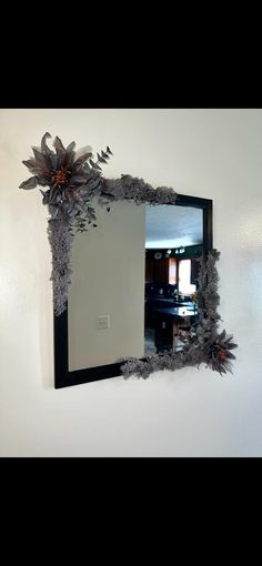 a mirror that is hanging on the wall