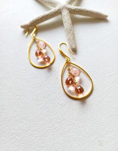 Beautiful pair of dainty earrings made with cultured  glass teardrops. The teardrops hang from gold filled chains on gold plated ear wires. Arrives in a jewelry box, perfect for gifting. Colours may vary slightly depending on the setting of your monitor. Please choose teardrops colours from drop down menu. If you need a bigger quantity or any customized jewellery for your very special occasion (birthdays, weddings, bridal showers or any other event), please send me a message and I'll be glad to Glass Teardrop Jewelry With Matching Earrings, Wire Wrapped Teardrop Earrings For Party, Gold Teardrop Glass Earrings, Czech Glass Teardrop Earrings With Ear Wire, Teardrop Chandelier Earrings With Dangling Beads For Gift, Teardrop Czech Glass Jewelry For Parties, Teardrop Chandelier Earrings With Dangling Beads As A Gift, Czech Glass Teardrop Jewelry For Parties, Party Teardrop Czech Glass Jewelry