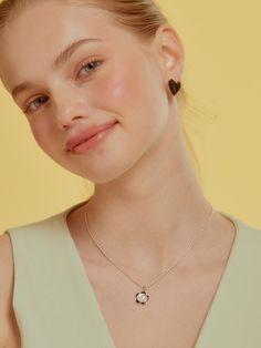 Editor's NotesTATIANA's jewelry is unique and timeless for everyday wear.- Light-weighted Mother of pearl Flower Egg Chain Necklace- Eye-catching kitche point detail - Classic and minimal style- Daily point itemMeasurements(in.)- Size 16.5in.Composition & Care- Chain_925 Sterling SilverPendant_Brass,Mother-of-pearl,Epoxy,CZ- Avoid direct heat and moisture- Professional cleaning is recommendedDesigner- by TATIANA