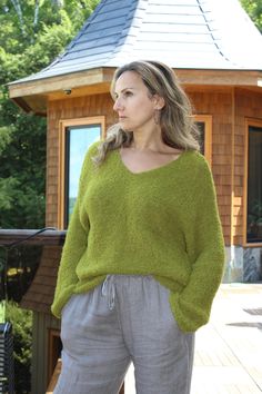 Hand knit Alpaca wool V-neck sweater pullover features dropped shoulder , relaxed fit , V-neck line .Absolutely itch free ! Made of 90% Peruvian alpaca and Merino wool blend. Very soft and warm. Peruvian Alpaca is well known for unique quality and softness. Model is size M and wearing size M/L. Recommended care : Hand wash and Lay flat to dry. Winter Relaxed Fit V-neck Sweater, Green Knit V-neck Sweater, Relaxed Fit V-neck Sweater, Chunky Knit V-neck Sweater For Fall, Oversized V-neck Chunky Knit Sweater, Oversized Green V-neck Sweater, Soft Knit V-neck Sweater With Relaxed Fit, Oversized Chunky Knit V-neck Sweater, Relaxed Fit Knit V-neck Sweater