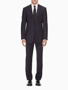 A timeless classic, this updated navy suit jacket is cut in a contoured, slim fit design. Made with high notch lapels, a 2 button closure and a double vent at the back. Crafted with slight stretch in a four season weight wool.  Material: 94% Wool, 6% Spandex. Navy Suit, Timeless Classic, Calvin Klein, Suit Jacket, Slim Fit, Navy, Design