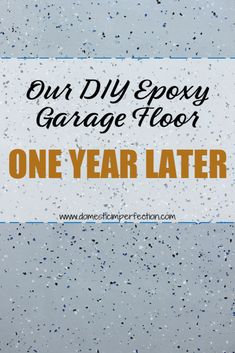 a garage door with the words our diy epoxy garage floor one year later