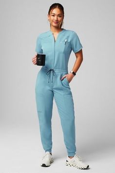 Empower Scrub Jumpsuit - Yitty Dentist Scrubs Woman, Female Doctor Photoshoot, Nurses Scrubs Outfits, Nurse Style Scrubs Fashion, Scrubs Jumpsuit, Scrubs Uniform Aesthetic, Doctor Outfit Ideas, Nursing Outfits Scrubs, Scrub Outfit Ideas