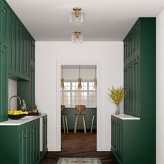 a kitchen with green cabinets and white walls