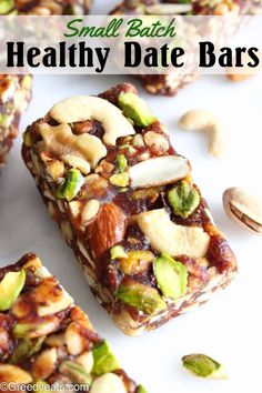 small batch healthy date bars with nuts and cashews on the top, in front of them