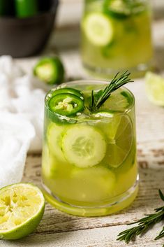 two glasses filled with cucumber and lemonade