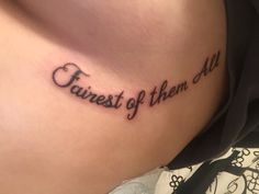 a woman's stomach with a tattoo saying, fairest of them all