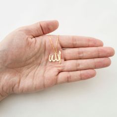 This necklace is a piece of our new collection of Allah necklace made from sterling silver and 14k gold. The collection includes different designs that suit all tastes Kufi/calligraphy, heart/rectangle/triangle shapes, tiny/big sizes. Here is the link for the full collection: https://etsy.me/2Swd0lP All the designs can be made as necklace, bracelet, and earrings. If you also want a complete set that includes a necklace, a bracelet and earrings please get in touch with us. We accept custom orders Kufi Calligraphy, Allah Necklace, Calligraphy Heart, Allah Pendant, Skin Craft, Arabic Jewelry, Islamic Jewelry, Minimal Gold, Letter Ring