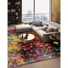 a modern living room with colorful rugs and furniture