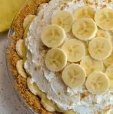 a pie topped with bananas and whipped cream