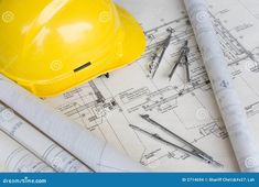 yellow hard hat and tools on blueprint with construction drawings stock photo image of engineering