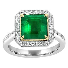 From our signature Gemstones collection of exquisite red carpet pieces, this handcrafted 18k Two-Tone gold ring is centering a 3.56 Carat of top quality Ethiopian square green emerald in premium luster encircled by a halo of brilliant round diamonds. This beautiful ring features delicate Micro-Prong-set diamond accents on the band add a truly dazzling effect. The perfect combination of natural elegance and breathtaking sparkle, this ring will delight classic lovers everywhere. It's 2.2 MM wide a