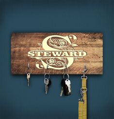 a wooden sign with keys hanging from it's sides and the name steward on it