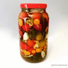 a jar filled with lots of different types of vegetables