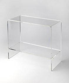 a clear acrylic shelf with two shelves on each side