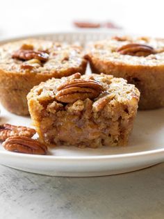 several pieces of pecan pie on a white plate