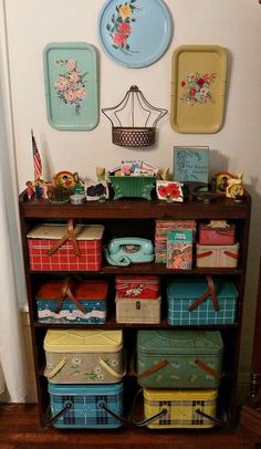 a wooden shelf filled with lots of colorful boxes