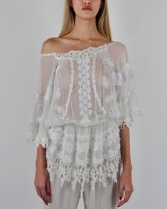 Introducing our Butterfly Tunic, a symbol of delicacy and sensuality. This exquisite piece features an elasticized low waist for a comfortable yet flattering fit, while whimsical lace collage adorns it throughout, adding a touch of charm and allure. Crafted from 100% Silk Chiffon, it is available in Black, White, and elegant Ivory. Embrace the softness and elegance of our Butterfly Tunic and make a statement wherever you go. 100% Silk Chiffon Black, White and Ivory Slip on, slip off Dry clean on Lace Collage, Slim Pants, Silk Chiffon, Low Waist, Chiffon, Dry Clean, Black White, Silk, Collage