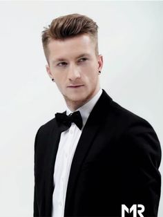 a man in a tuxedo and bow tie