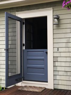 an open blue door on the outside of a house