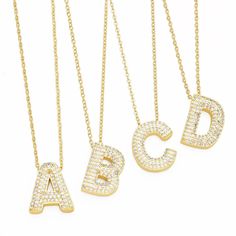 Want a cute and personalized addition to your jewelry collection? Look no further than our Gold Rhinestone Letter Initial Necklace! Made with Stainless Steel Copper and 18k Gold Plated Zircon, this chunky and fun necklace is a real statement piece. The classic gold and bubble letter styling make it the perfect gift for a loved one (or yourself)! A Initial, Bubble Letter, Rhinestone Letters, Letter Pendant Necklace, Initial Pendant Necklace, Blue Gifts, Custom Name Necklace, Gold Rhinestone, Letter Pendants