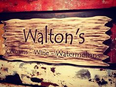 a wooden sign that reads walton's worms wine - watermelons