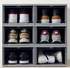 several pairs of shoes are stored in clear bins