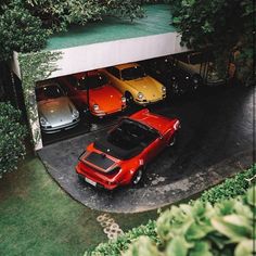 three cars are parked in a parking garage