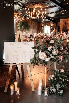 a table with flowers and candles is set up for a wedding reception at the venue