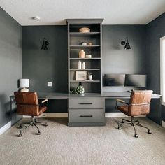 an office with two chairs and a desk in the corner, along with shelving units