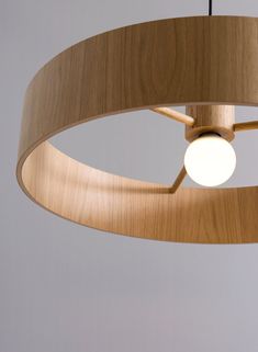 a wooden light fixture hanging from the ceiling