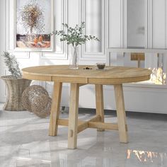 a wooden table sitting in front of a fire place next to a vase with flowers