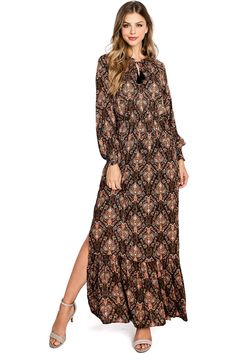 Stunning bohemian maxi dress with metallic threading for a perfect amount of sparkle. Long sleeves with a self-tie keyhole neckline. Leg slits on both sides. Short lining underneath. CARE | Dry Clean or Hand Wash Cold CONTENTS | Self: 99% Rayon 1% Lurex/ Lining: 100% Polyester MEASUREMENTS | 57"/145 cm Shoulder to Hem (Size Small) MODEL | 5'8 - wearing a size Small IMPORTED Elegant Boho Print Maxi Dress, Black Boho Print Maxi Length Dress, Black Boho Print Maxi Dress, Fall Black Maxi Dress With Boho Print, Bohemian Maxi, Bohemian Maxi Dress, Love Stitch, Keyhole Neckline, Threading