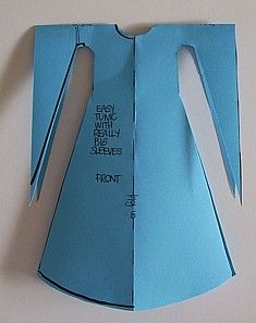 an origami dress made out of blue paper with words written on the back