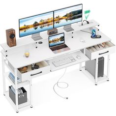 two computer monitors sitting on top of a white desk