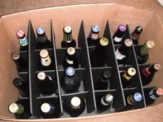 a cardboard box filled with lots of bottles