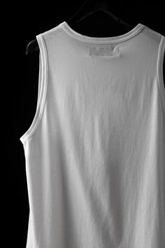 Body material: 100% cotton・Long tank top to accentuate your style with layering and more・Loose silhouette with a moderately relaxed feel・Light jersey material used for T-shirts, etc.・Rounded cut for a layered hemline・The draping that can only be achieved with long length garments.・Cotton jersey is soft and comfortable against the skin.・Lightweight fabric that does not bulk up when layeredCountry of origin / TURKIYE Relaxed-fit Model wear size: Large // 1/76 height 78 kg Measurement XSMALL Lenght Casual Cotton Racerback Tank Top, Casual Everyday Muscle Tank Tee, Summer Cotton Racerback Vest, Basic White Cotton Tank Top, White Cotton Basic Tank Top, Cotton Racerback Tank Top For Streetwear, Casual Relaxed Fit Tank Top For Everyday, Basic Cotton Tank Top For Spring, Spring Basic Cotton Tank Top