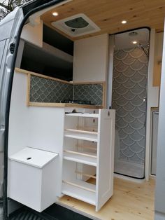 the interior of a van with its door open and shelves in place to store items