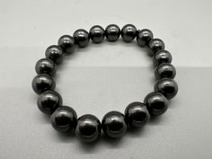 Shungite Bracelet,19 BEADS EMF Protection,Natural Shungite,Beaded bracelet,Gemstone Bracelet,10mm Round Gemstone Bracelet,For Girls,shungite wholesale Shungite is a very powerful stone that we recommend every person has in their home. It is said to be the "miracle stone" and/or "the stone of life." Shungite works to cleanse and align all the particles in the body so that they are open and in alignment with the light. It carries strong purifying, cleansing, and detoxifying properties. It can be u Shungite Bracelet, Shungite Stones, Bracelet For Girls, Psychic Protection, Emf Protection, Body Healing, Bracelet Gemstone, Gemstone Beaded Bracelets, Gemstone Bracelet