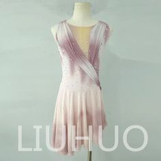 a pink and white dress on a mannequin with the words liuhuo written below it