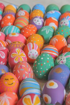 many different colored eggs with designs on them