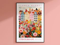 a flower market poster hangs on the wall in front of a pink wall with flowers