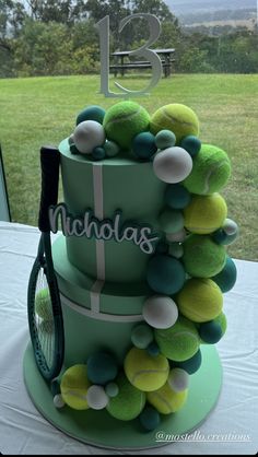 there is a tennis cake with balls on it and a racket in the middle