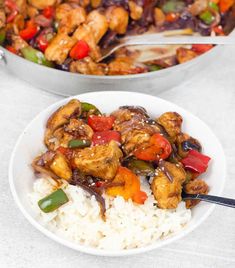 two white bowls filled with chicken and rice