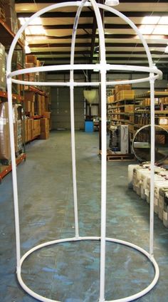 an empty warehouse filled with lots of shelves and boxes next to each other on the floor