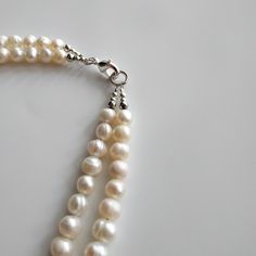 "< White and blue pearl necklace > It is well known fact, that pearls are the best accessory for weddings. But it is not only bridal jewelry. As Jackie Keneddy once said \"Pearls are always appropriate\". We can not disagree with this. Pearl jewelry is same perfect for special occasions and daily life. There is nothing more elegent and feminine like pearls. Every woman should have such a perfect beauty in her jewelry box. > Necklace's length- 39 cm (15,3 in) > Necklace's weight - 50 Gift Double Strand Beaded Necklace With Pearl Pendant, Double Strand Beaded Necklace With Pearl Pendant As Gift, Handmade Pearl Beaded Necklace For Anniversary, Anniversary Pearl White Double Strand Necklace, Pearl White Beaded Necklaces For Anniversary, White Double Strand Handmade Pearl Necklace, Pearl White Beaded Necklace With Round Beads For Anniversary, Double Strand Beaded Pearl Necklace Gift, Pearl White Necklace With Lobster Clasp As Gift