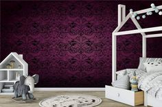 a child's bedroom with purple and black wallpaper