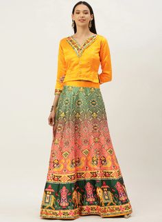 Make a vibrant style statement in this beautiful bandhni print yellow croptop lehenga choli. The A-line lehenga is made of smooth, shiney satin with a digital bandhni print in a fusion of traditional and modern styles. It comes with an unstitched printed silk blouse to complement the cropped choli. Style it for your next traditional occasion or festival to stand out from the crowd. #yellowlehenga #yellowlehengas #yellowlehengacholi #yellowlehengadress #yellowlehengadesigns #yellowlehengadesign #yellowcolorlehenga #designeryellowlehenga Digital Print Lehenga, Indian Dress, Chaniya Choli, Cropped Tops