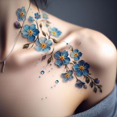 a woman's chest with blue flowers painted on it