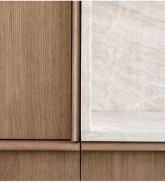 a wooden cabinet with white marble on top